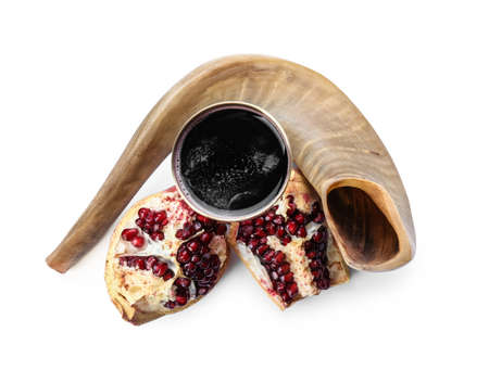 Shofar with sacramental goblet of wine and pomegranate on white background. Rosh hashanah (Jewish New Year) celebrationの写真素材