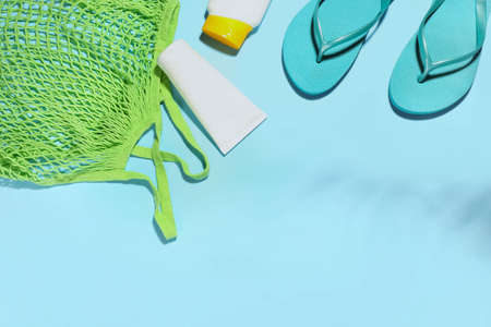 Set of beach accessories and cosmetics on color backgroundの写真素材