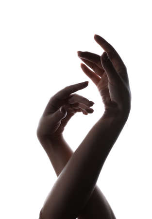 Silhouette of female hands isolated on whiteの写真素材