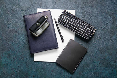 Stylish pencil case and stationery on dark backgroundの写真素材
