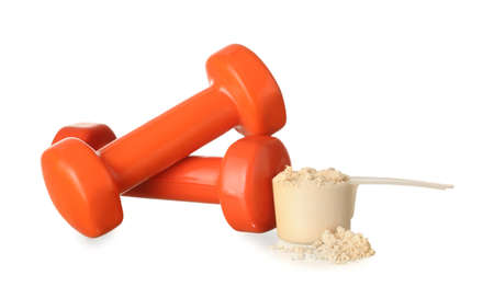 Dumbbells and measuring scoop with protein powder on white backgroundの写真素材