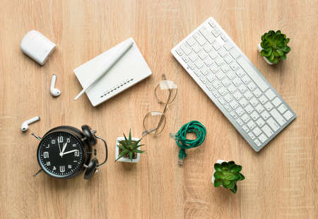 Different gadgets on wooden background