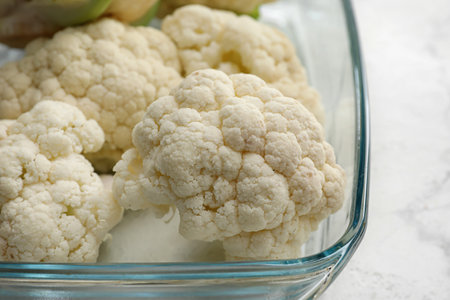 Baking dish with cauliflower cabbage on light background, closeupの写真素材