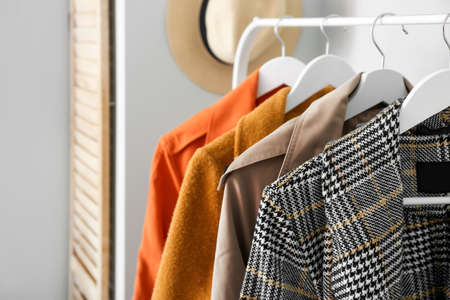 Rack with spring outwear in hallway, closeupの写真素材