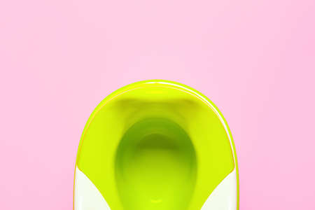 Green potty on color background, closeup