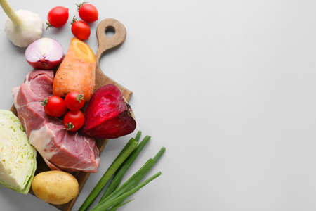 Ingredients for preparing borscht on light backgroundの写真素材