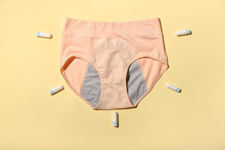 Period panties and tampons on color backgroundの写真素材