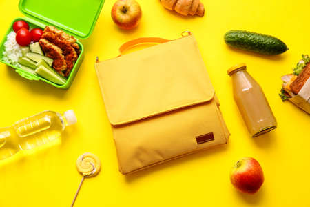 Lunch box bag and food on color backgroundの写真素材