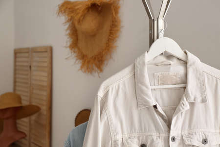 Rack with jacket in light room, closeupの写真素材