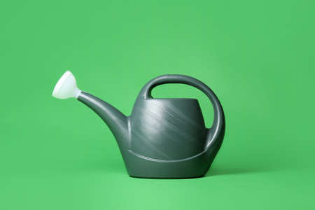 Watering can on color backgroundの写真素材