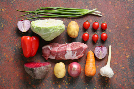 Ingredients for preparing tasty borscht on grunge backgroundの写真素材