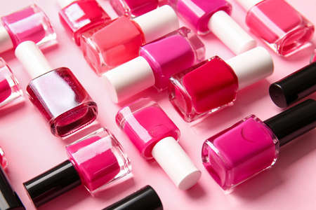 Bottles of nail polishes on color backgroundの写真素材