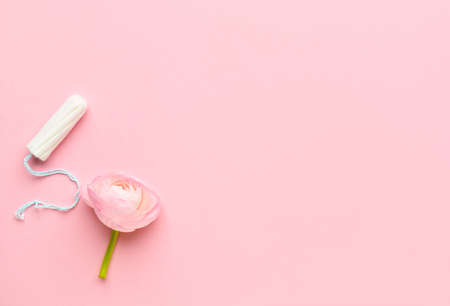 Tampon and flower on color backgroundの写真素材