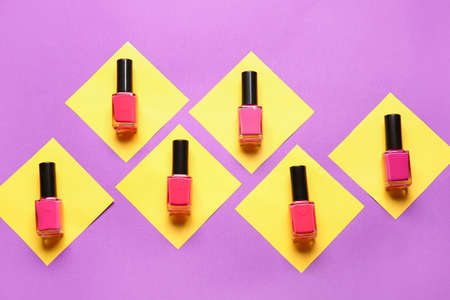 Bottles of nail polishes on color backgroundの写真素材
