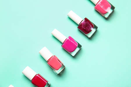 Bottles of nail polishes on color backgroundの写真素材