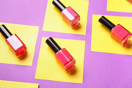 Bottles of nail polishes on color backgroundの写真素材