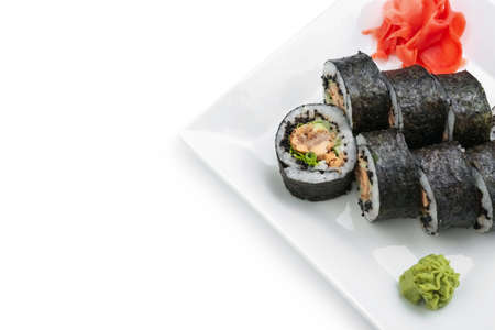 Plate with delicious sushi rolls on white backgroundの写真素材