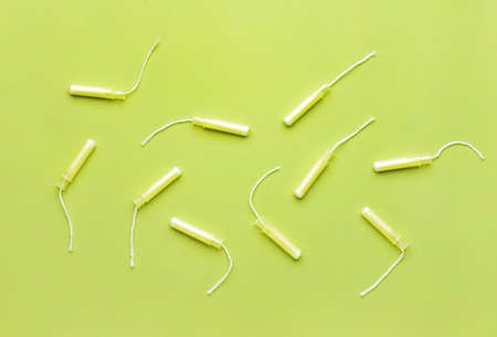 Menstrual tampons on green background