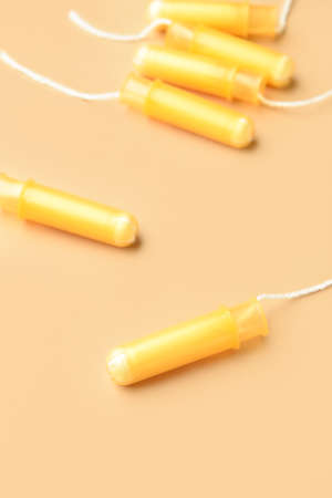 Menstrual tampons on yellow background