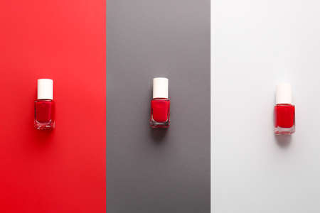 Bottles of nail polishes on color backgroundの写真素材