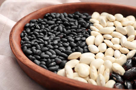 Bowl with different types of beans, closeup