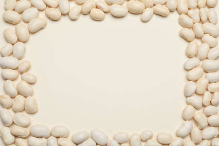 Frame made of raw beans on white backgroundの写真素材