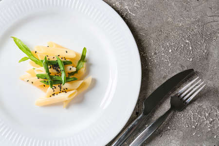 Plate of tasty pasta on dark background, closeupの写真素材