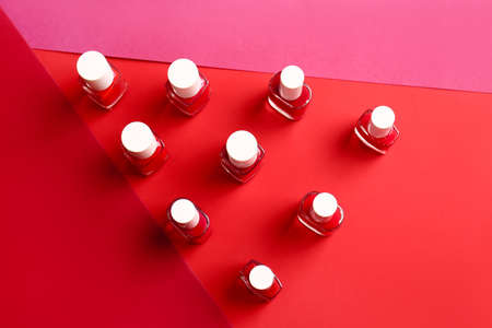 Bottles of nail polishes on color backgroundの写真素材