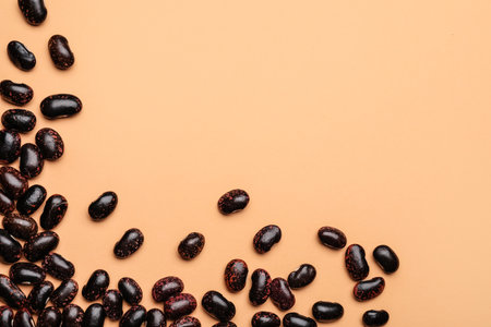 Raw beans on color backgroundの写真素材