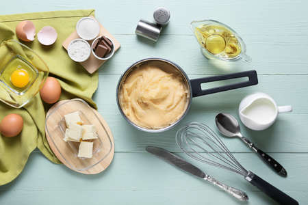 Ingredients for preparing churros on color wooden backgroundの写真素材