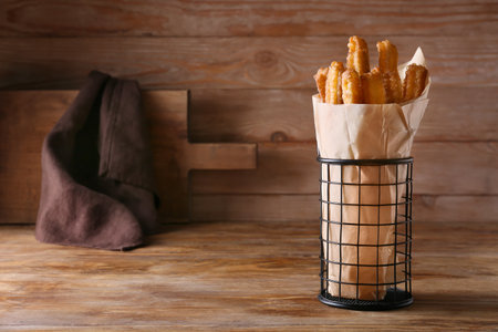 Tasty churros on wooden backgroundの写真素材