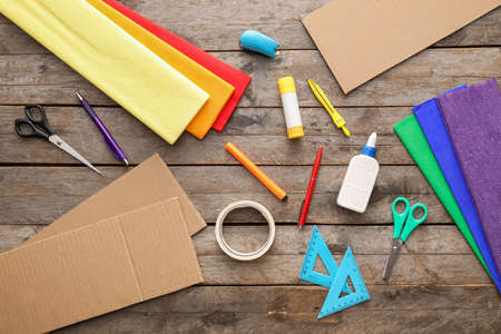 Materials for making Mexican pinata on wooden background