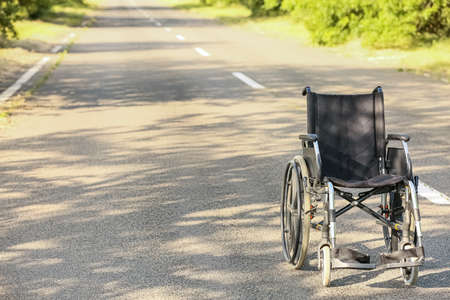 Empty modern wheelchair on road outdoorsの写真素材