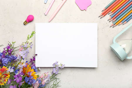 Blank sheet of paper, bouquet of flowers and stationery on light background, closeup. teacher's day...