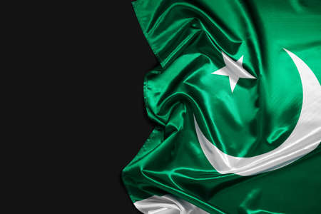 Pakistan flag on dark backgroundの写真素材