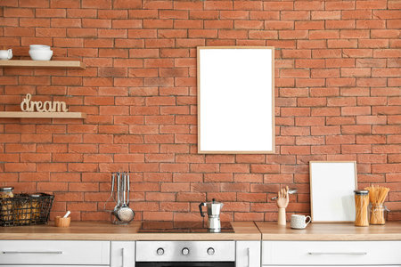 Interior of modern kitchen with blank photo framesの写真素材