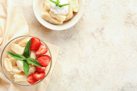 Bowls with tasty lazy dumplings on light backgroundの写真素材