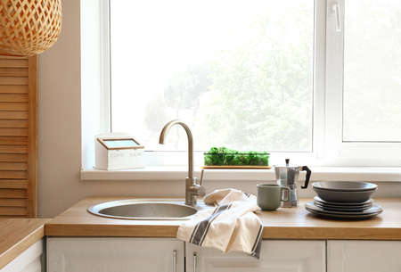 Interior of modern kitchen with big windowの写真素材