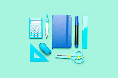 school supplies on color background