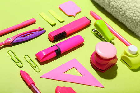 school supplies on color background