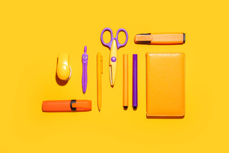 school supplies on color background