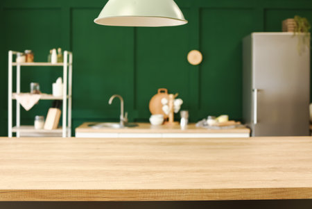 Empty wooden table on blurred kitchen interior backgroundの写真素材