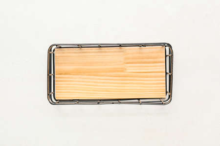 Empty wardrobe organizer on light wooden background