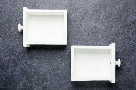 White drawers on dark backgroundの写真素材