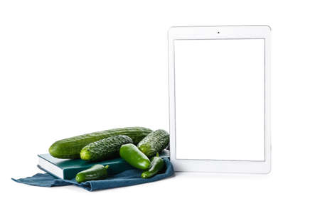 Composition with digital recipe book on white backgroundの写真素材