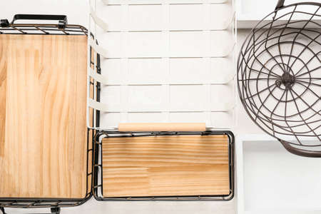 Different wardrobe organizers on light background