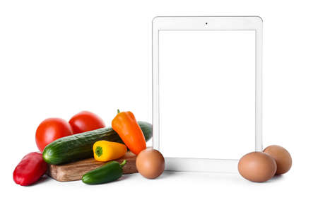 Composition with digital recipe book on white backgroundの写真素材