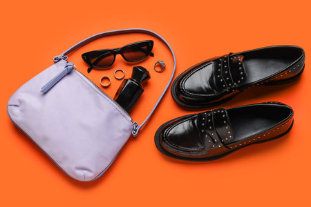 Composition with trendy handbag, shoes and accessories on color backgroundの写真素材