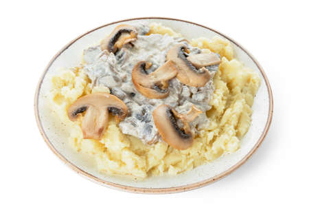 Plate with tasty mashed potatoes and mushrooms on white backgroundの写真素材