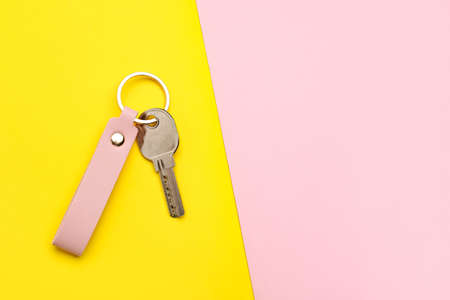 Key with leather keychain on color backgroundの写真素材
